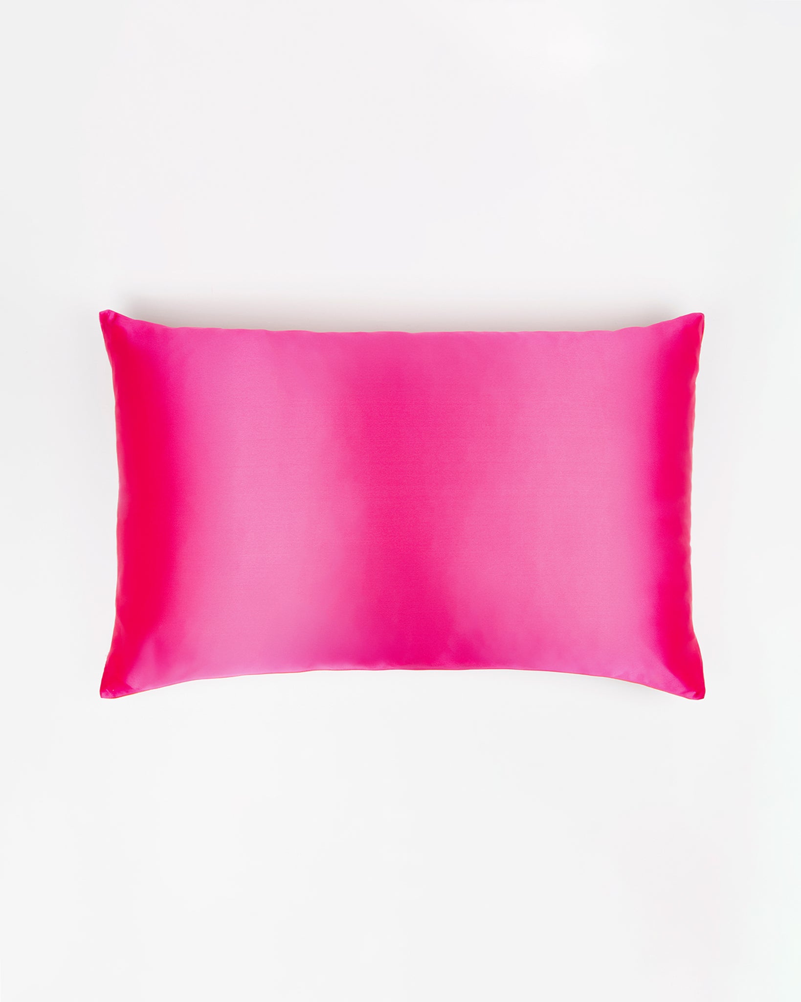 Pink silk pillowcase on a white background