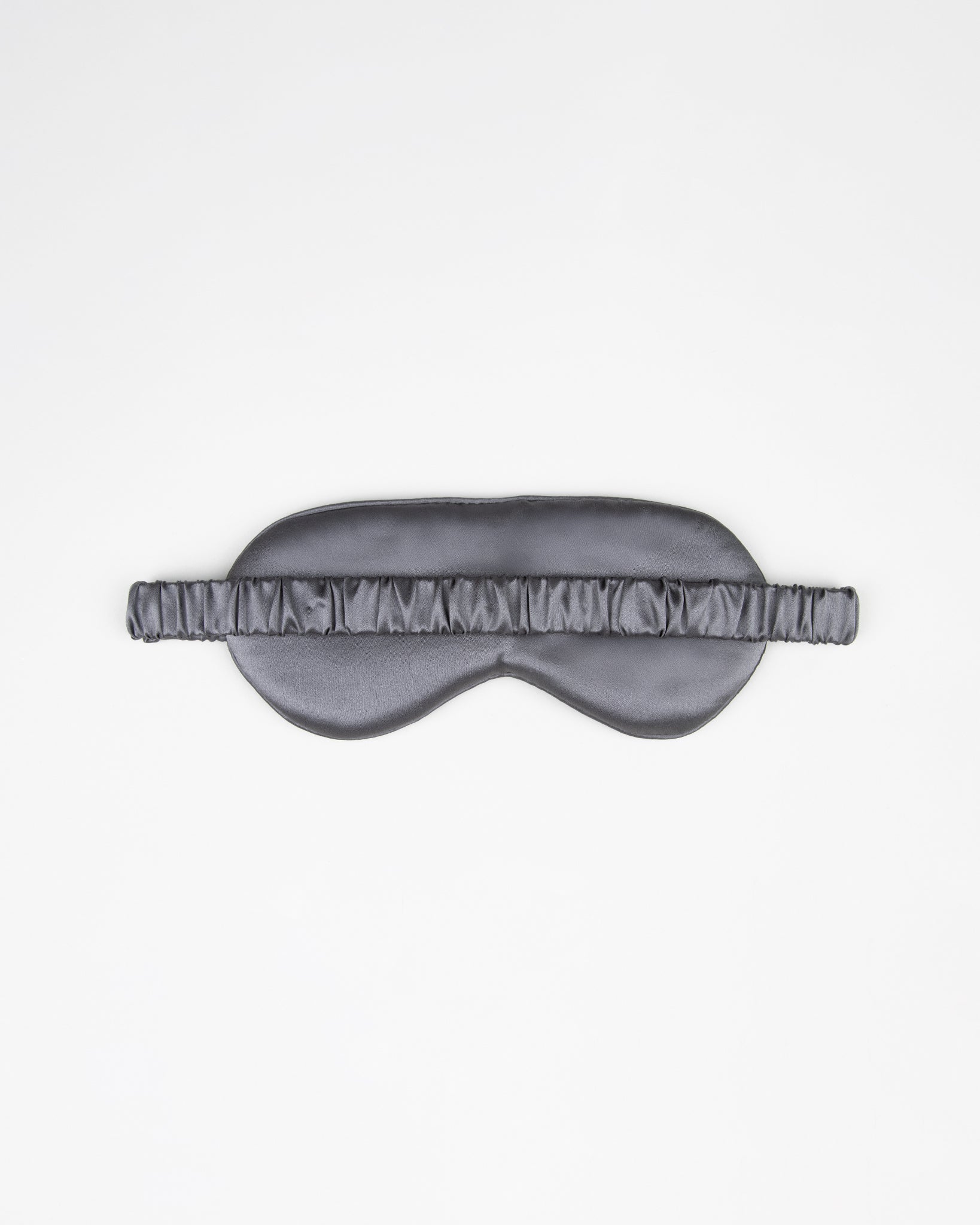 Gray silk sleep mask on a white background